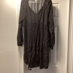 Black dress with white design and tie neck